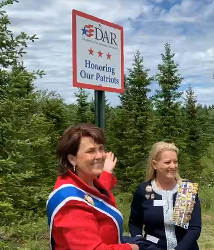 DAR’s President General Denise Doring VanBuren and Chris Wood unveil DAR’s section of WAA’s Remembrance Tree Program