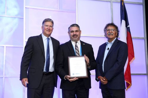 ort of Long Beach Deputy Executive Director Rick Cameron accepts the AAPA’s Lighthouse Award of Excellence for Environmental Improvement on behalf of the Port's Planning and Environmental Affairs Bureau. He is accompanied by AAPA President and CEO Chris Connor (left) and Port of Long Beach Executive Director Mario Cordero (right). image