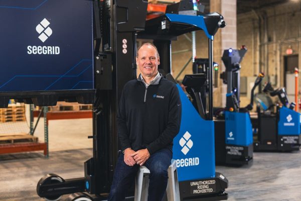 Joe Pajer, CEO and President of Seegrid with Lift CR1, Lift RS1, and Tow Tractor S7 AMRs. image