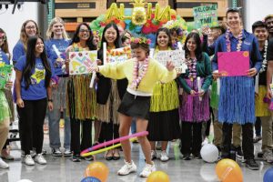 Carla Clark | For The Republic Surrounded by Toyota employees, Harper Booram tries to hula hoop after she is told she and her family are going to Hawaii during the Toyota Make-A-Wish CEO for the Day at Toyota Material Handling, Columbus, Ind., Wednesday, June 11, 2025 image