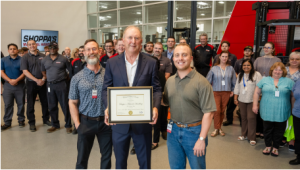 Jimmy Shoppa (center) receives an official Commendation from the Office of the United States Senate, recognizing Shoppa’s Material Handling intralogistics leadership. The award was presented by Michael Flusche (left) and Giovanni Catanzaro (right) from Senator Ted Cruz’s office.